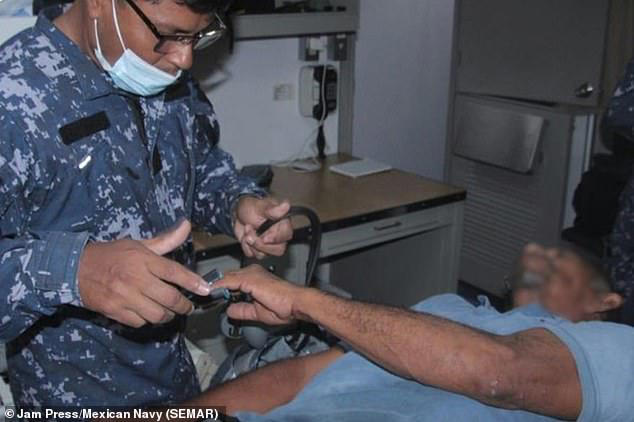 Naval medical personnel assessed both men before they were transported by helicopter to hospital, where they were treated for severe dehydration