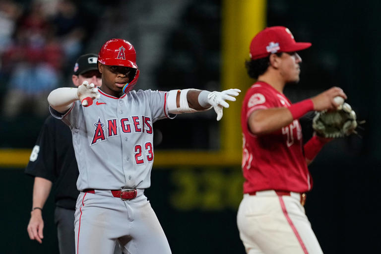 Scoreless through 9, Rangers beat Angels 2-1 as Langford has tying RBI ...