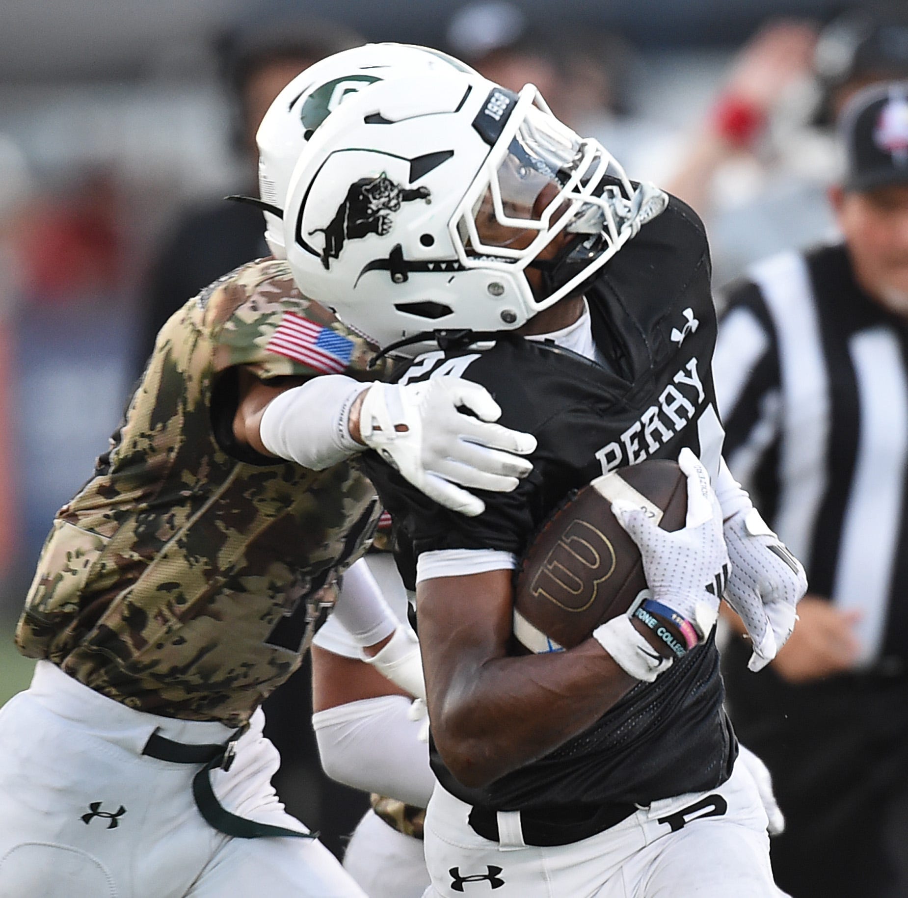 OHSAA football scores, Perry vs. Warren Harding. Raiders roll to road win