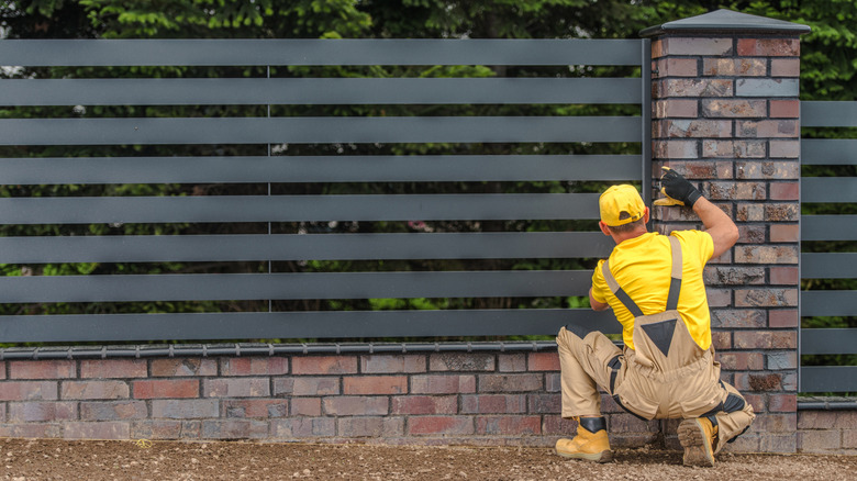 How far off your property line should you build a fence?