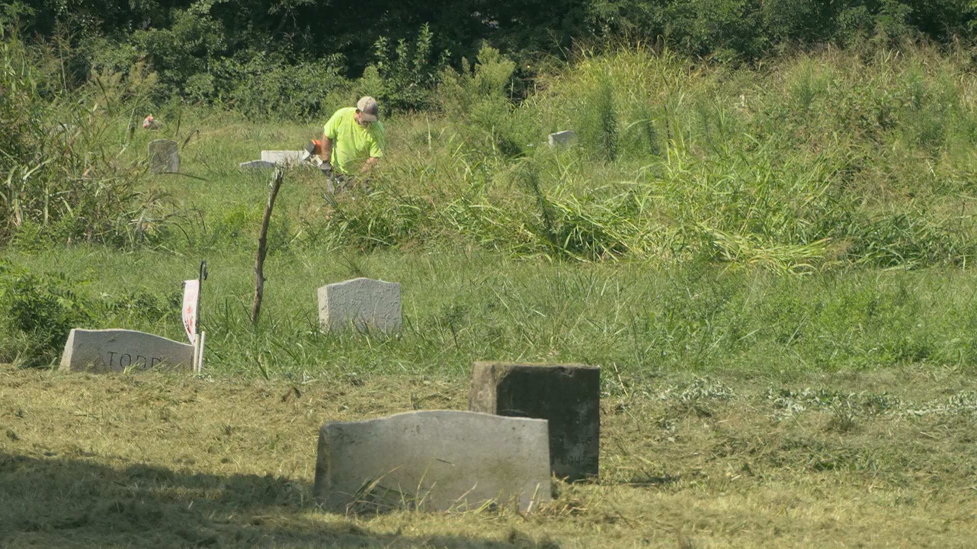 Volunteers make headway on cleaning up Louisville cemetery