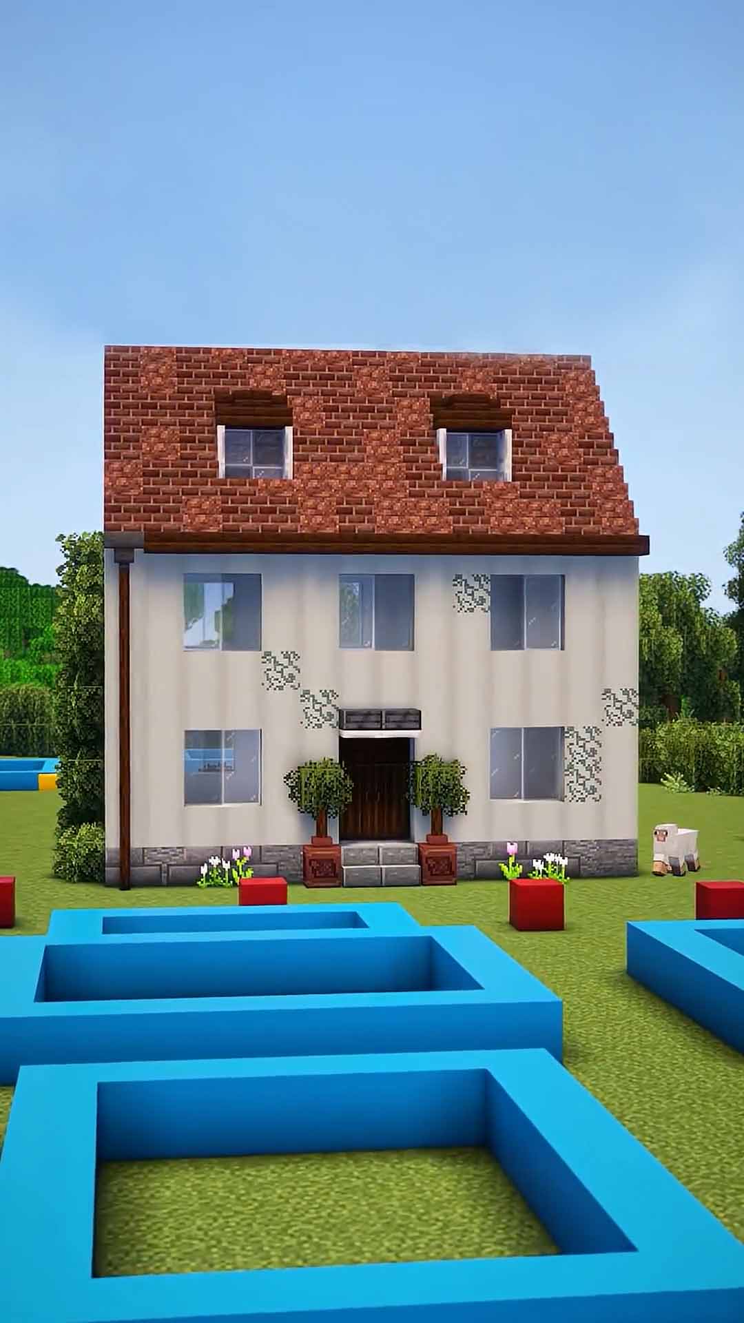 A simple Minecraft family home with pool and garden details