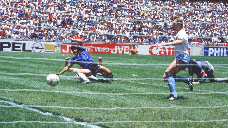 Maradona scores his second goal against England. Pic: Sven Simon/picture-alliance/dpa/AP