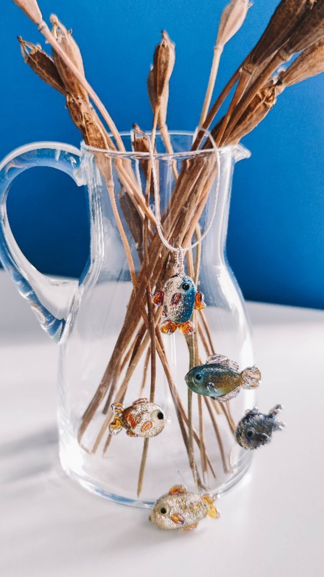 What makes these enamel glass fish designs unique?