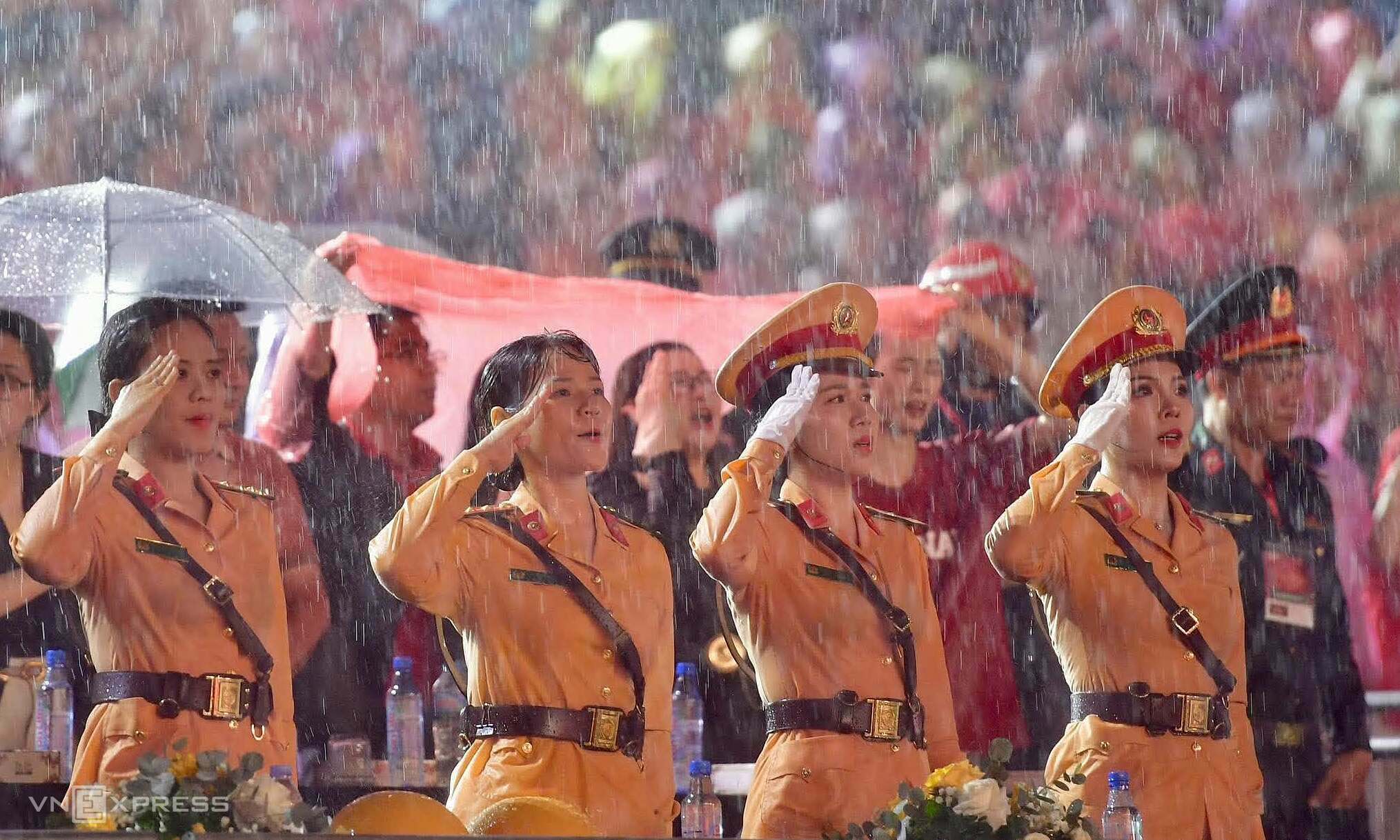 Thousands sing Vietnam's national anthem in pouring rain at national ...