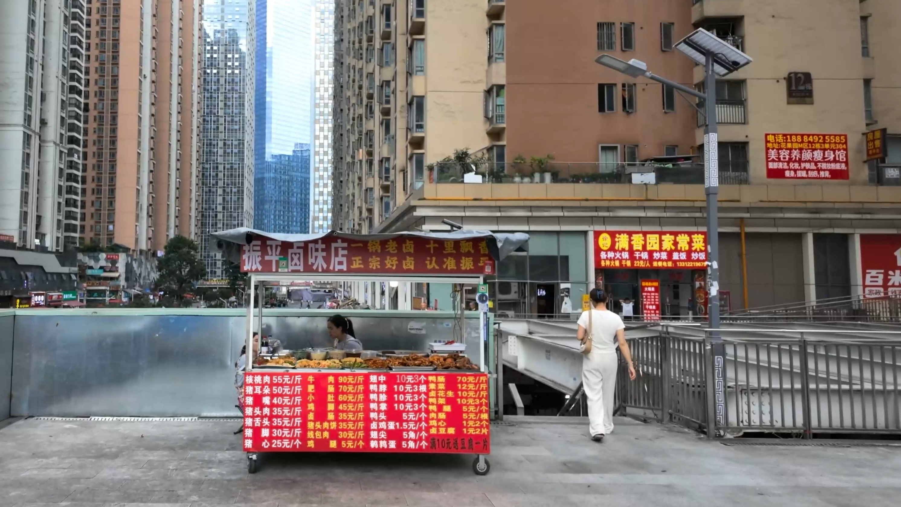 owering Apartment Blocks Frame This Chinese Street Food Stall