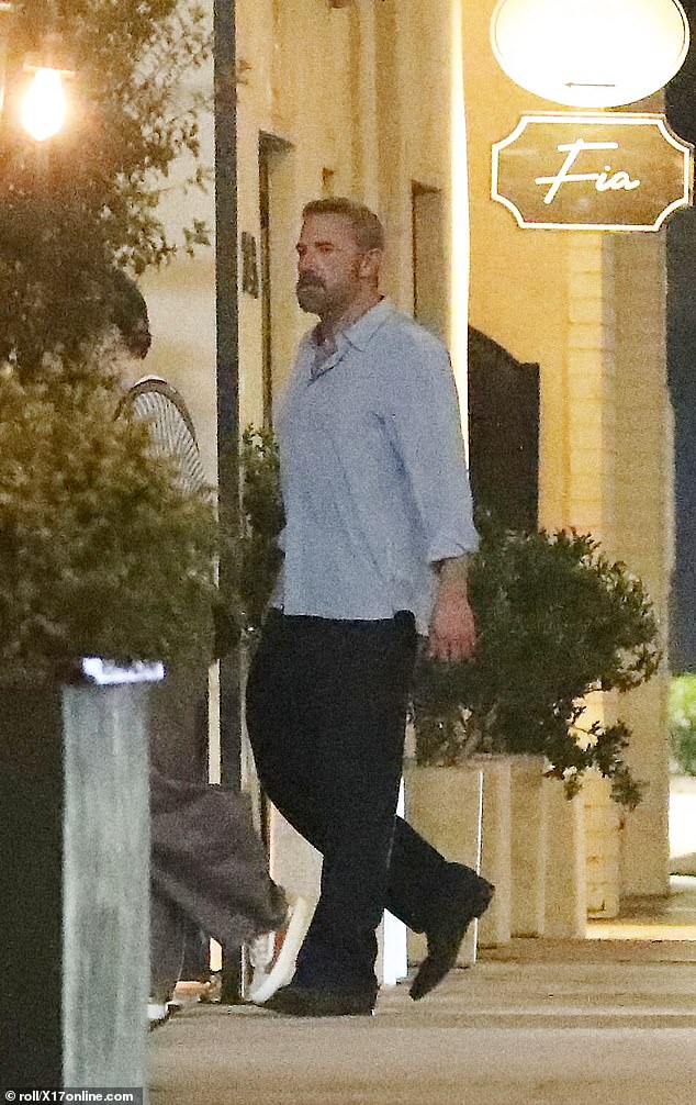 Affleck was on dad duty in a light blue button-up shirt, black pants, and loafers