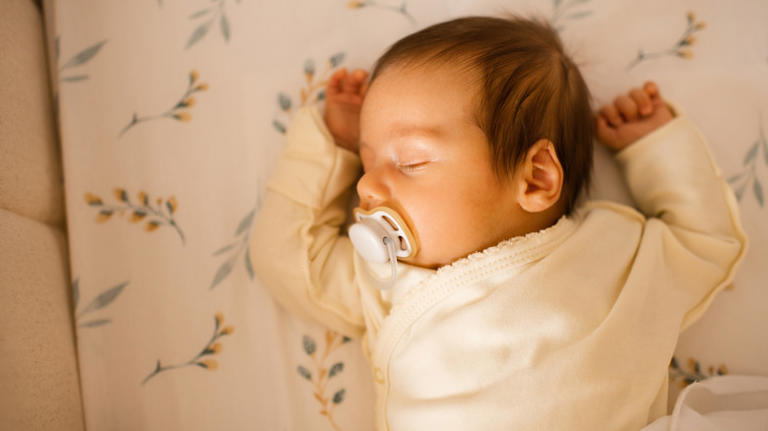 Why do pacifiers have a hole in the middle?