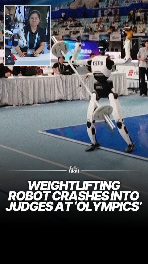 Weightlifting robot collapses onto judges' table during Olympics