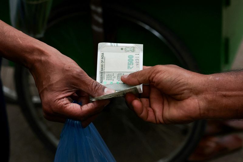 Rupee bolted in place by central bank muscle, traders wince