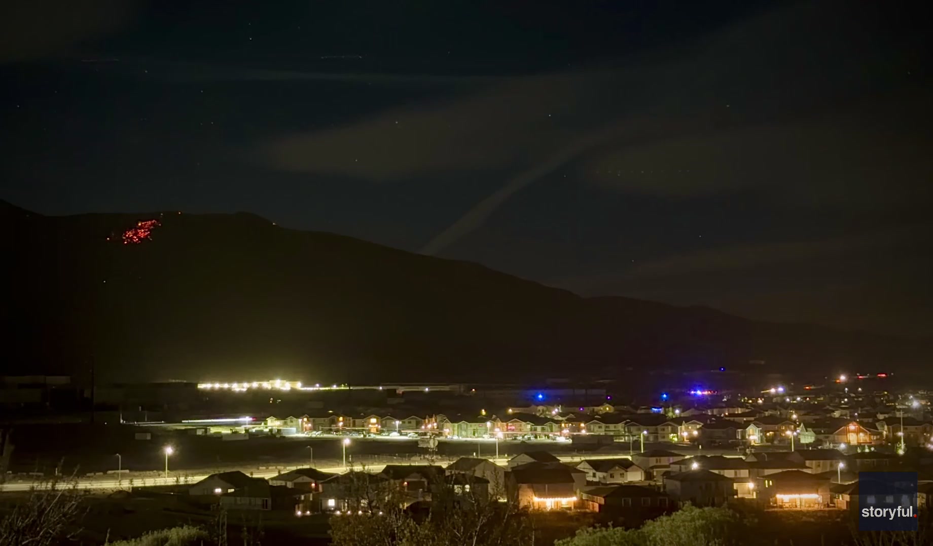 Hawk fire glows on mountainside over Reno's North Valleys