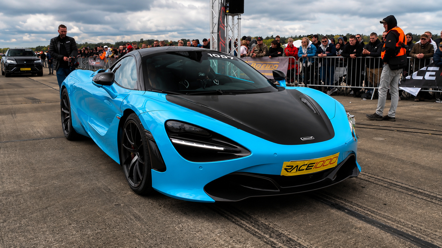 This McLaren draws a crowd before the racing action begins