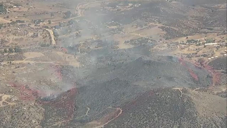 Evacuations downgraded as crews gain control of brush fire in Riverside ...