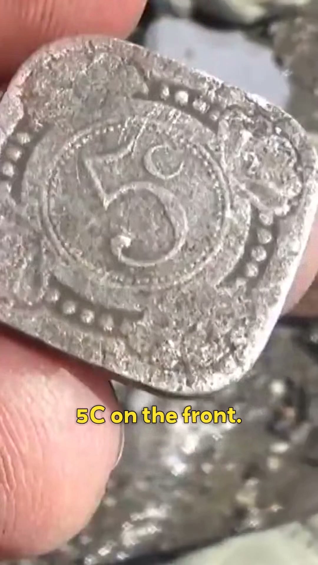 A square coin found on the Thames