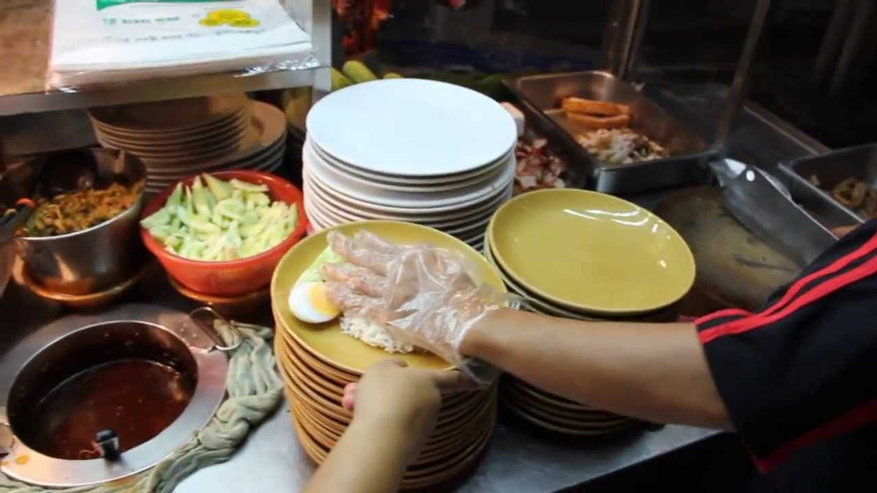 This Bangkok street cook moves so fast... it barely looks human