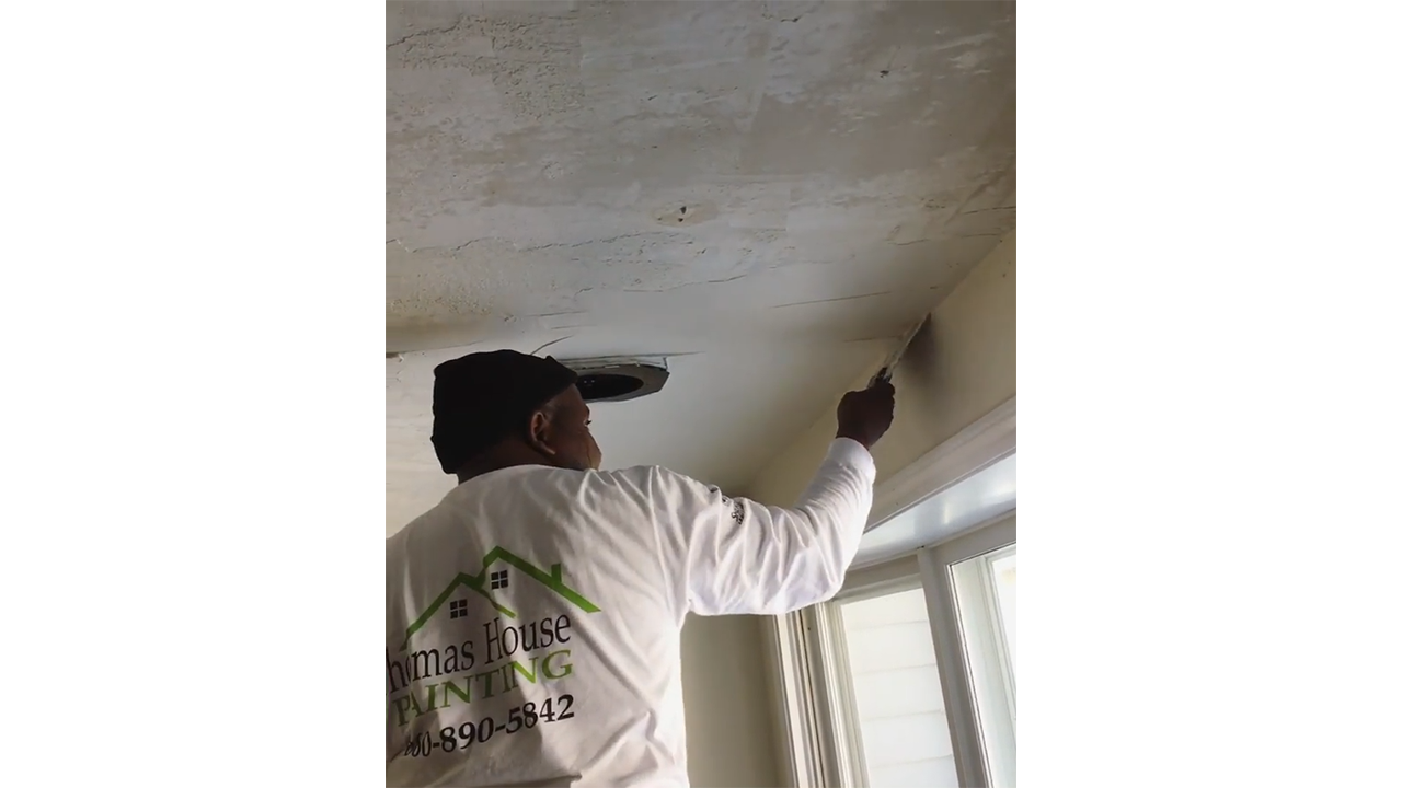 Applying joint compound to uneven ceiling producing flat interior finish