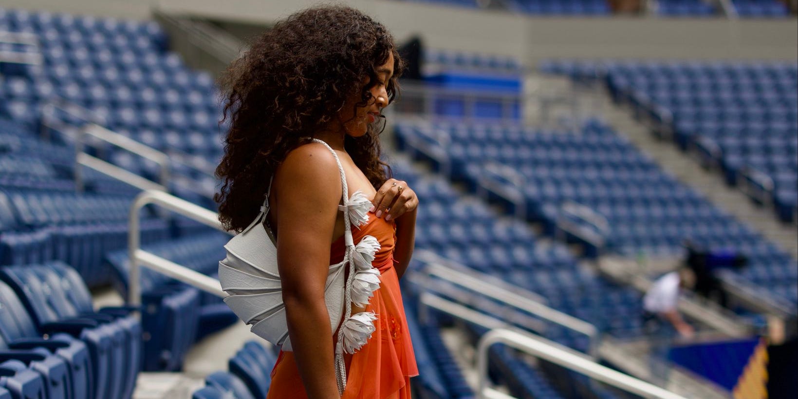 Naomi Osaka launches her US Open wardrobe with a strapless orange style