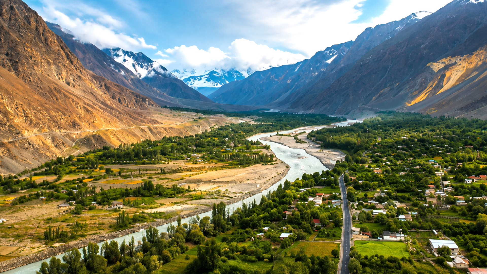 a-winding-river-cutting-through-hunza-valley-s-towering-mountains