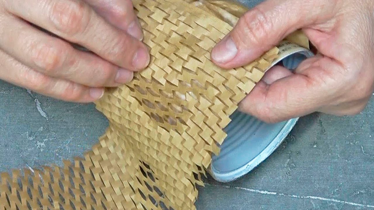 Upcycle a tin can and packaging paper into art
