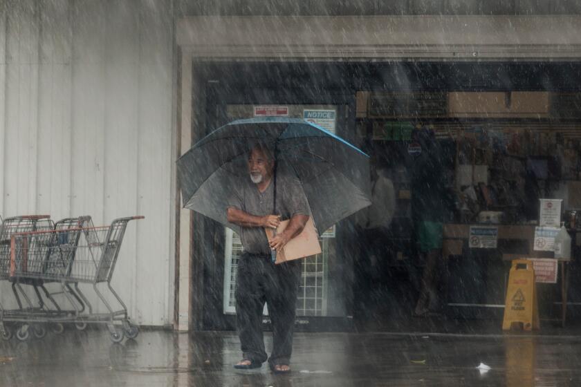 Lala weakens to tropical storm, but rain and winds still battering Hawaii