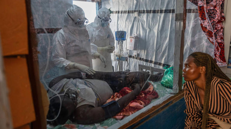 Medics tend to an Ebola patient in Ituri, one of the DRC's hardest-hit provinces. Pic: AP