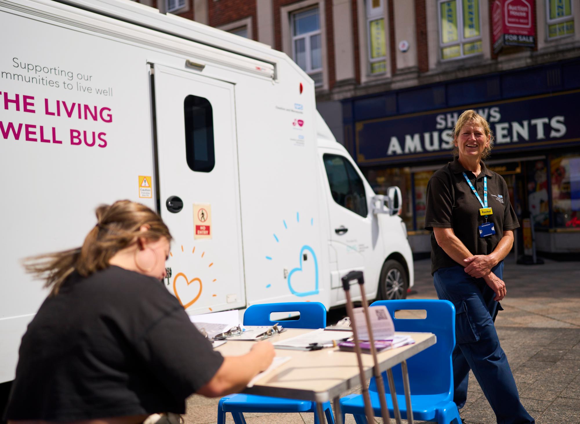 Staff welcome women to the Living Well Bus in Warrington town centre which offers appointment-free cervical screening. Photograph: Christopher Thomond/The Guardian