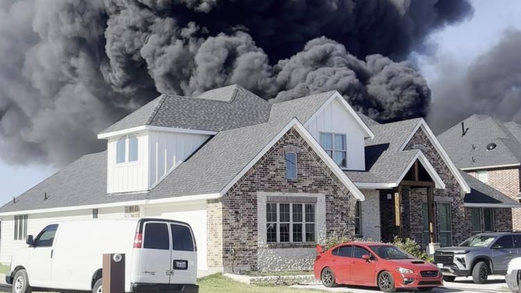 Tire fire in southern Dallas creating large black smoke plume that's visible from neighboring counties