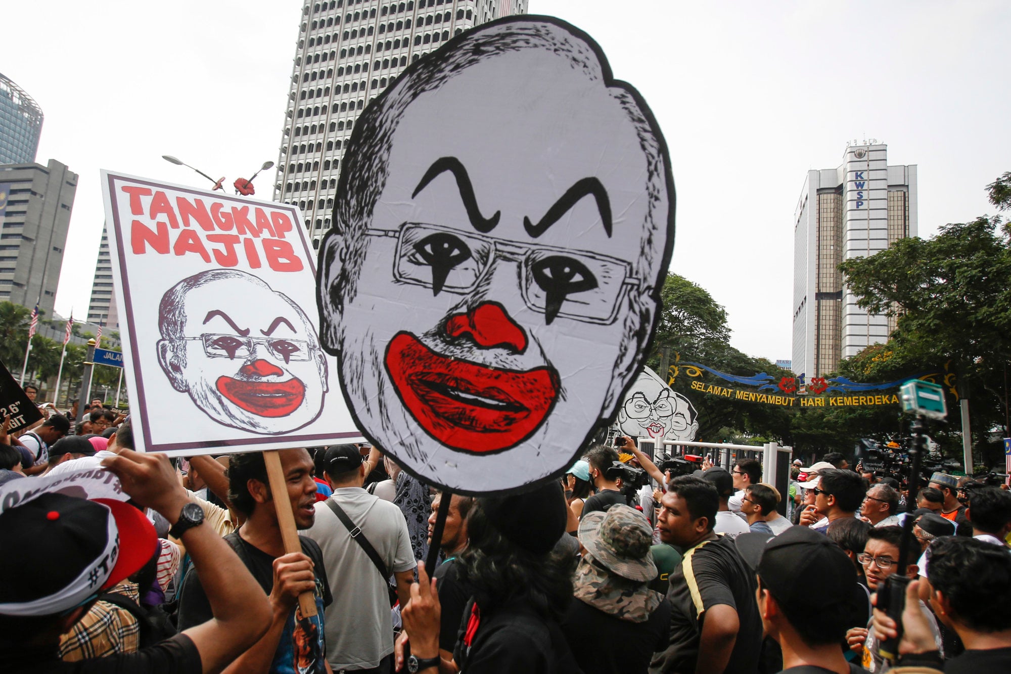 Student activists hold up a caricature of Malaysian Prime Minister Najib Razak during a rally calling for the arrest of
