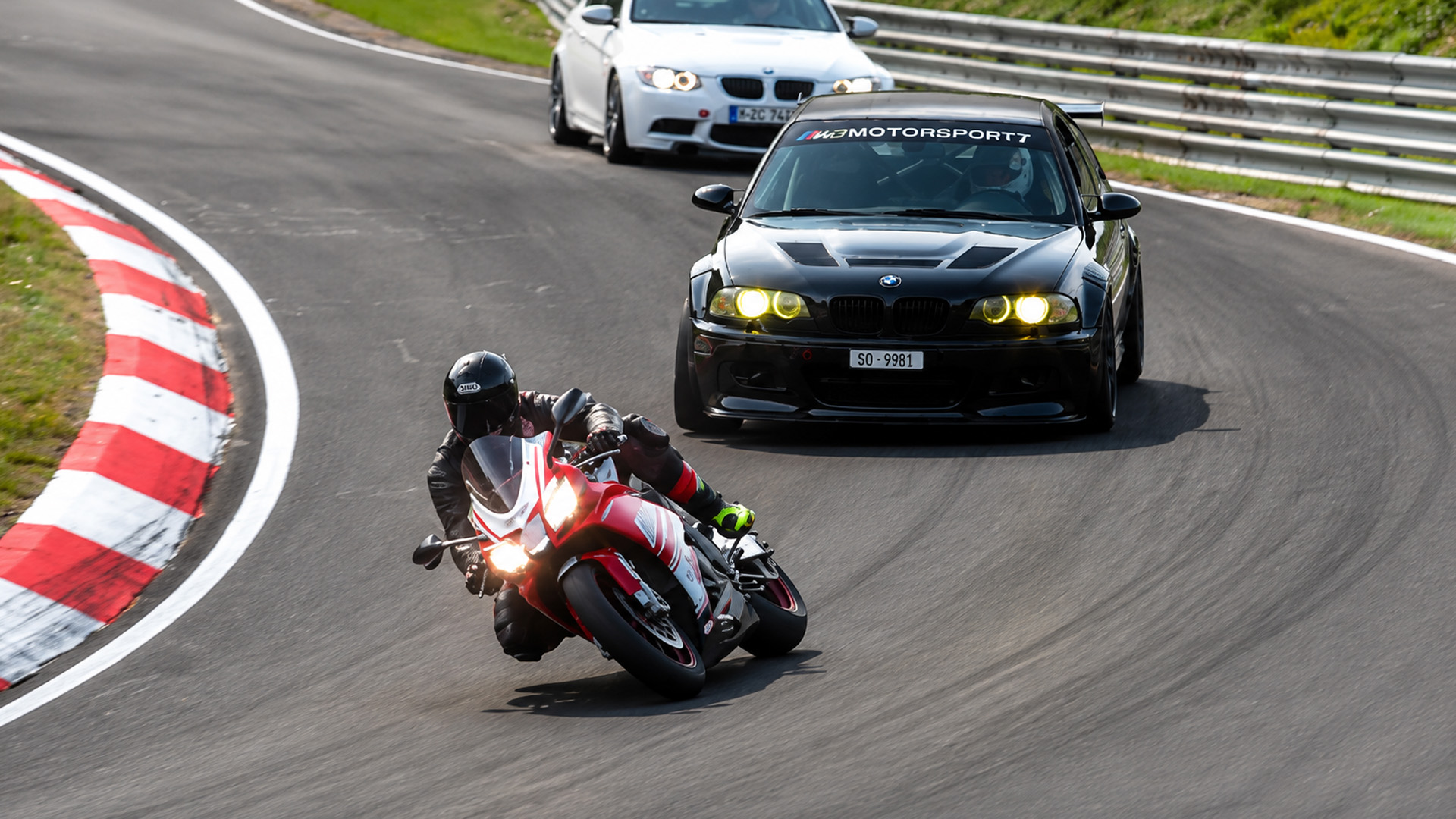 Superbike challenges modified BMW in a tight Nürburgring track battle