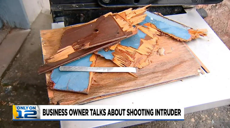 Damage could be seen around the garage door Voyles used to enter the closed business (Picture: KPTV)