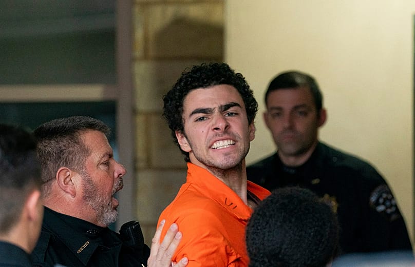 FILE - Suspect Luigi Mangione is taken into the Blair County Courthouse on Tuesday, Dec. 10, 2024, in Hollidaysburg, Pennsylvania Benjamin B. Braun/Pittsburgh Post-Gazette