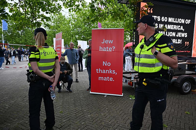 Police patrol near a banner outside of a venue in Arnhem, Netherlands, where West was performing - Saturday 6 June 2026 AP Photo