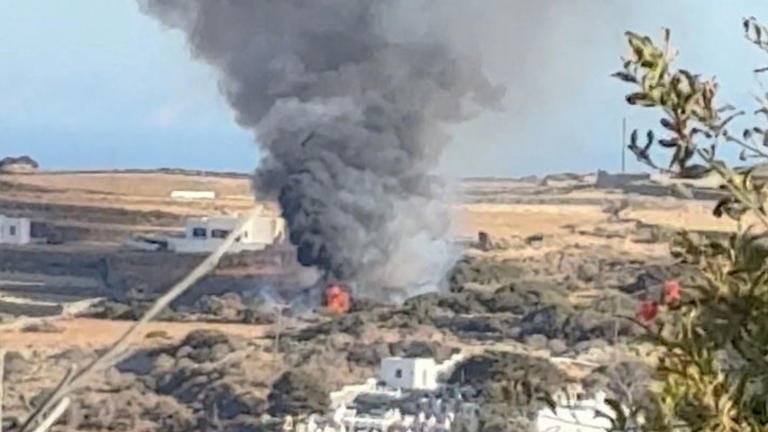 Smoke rising from the crash site in Sifnos. Pic: Reuters