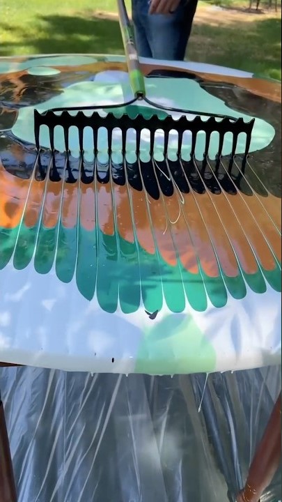 He uses a yard rake to refurbish the table!
