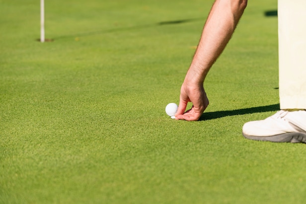 Rules of golf review: He didn't use a club to move his ball marker. Is that legal?