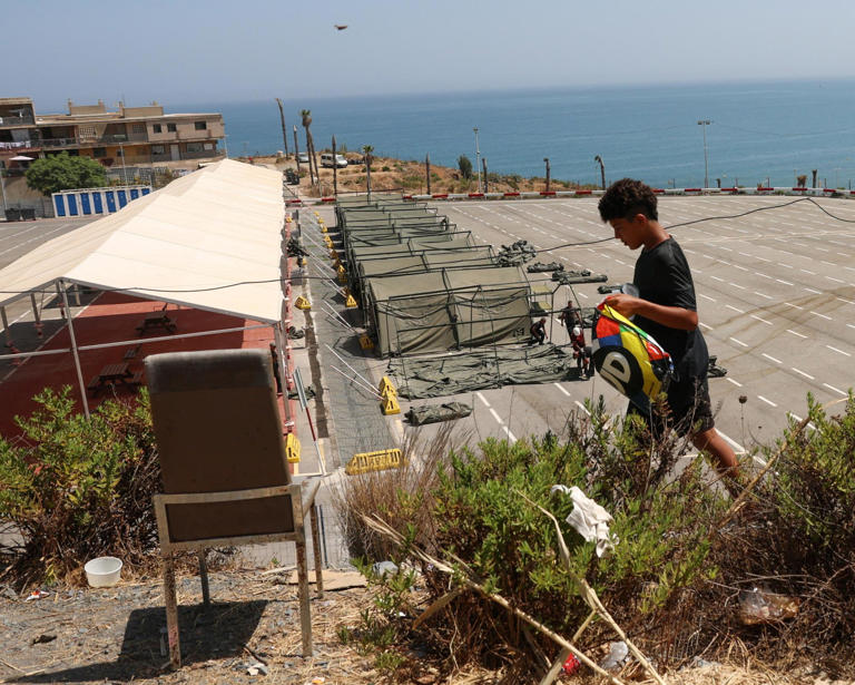 Tents being set up in a public car park in Ceuta on Tuesday. Photograph: Violeta Santos Moura/Reuters