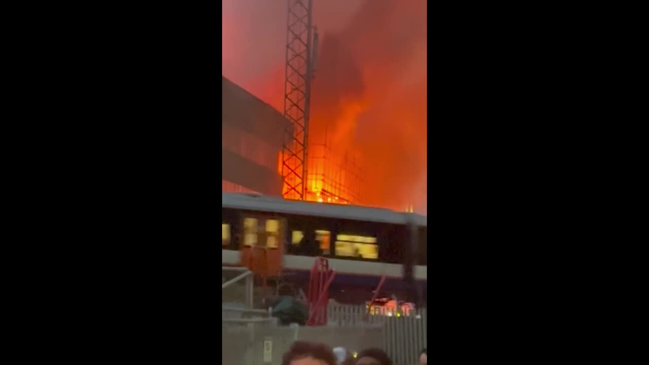 Massive fire sends flames and smoke above recycling center in London, UK