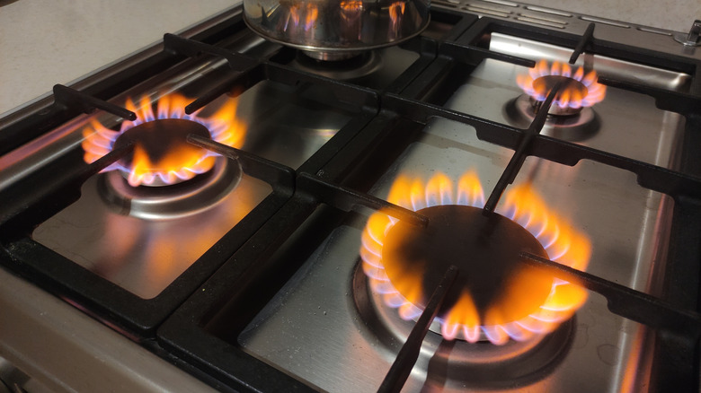 Orange flames on your gas stove? Here's the first step you should take