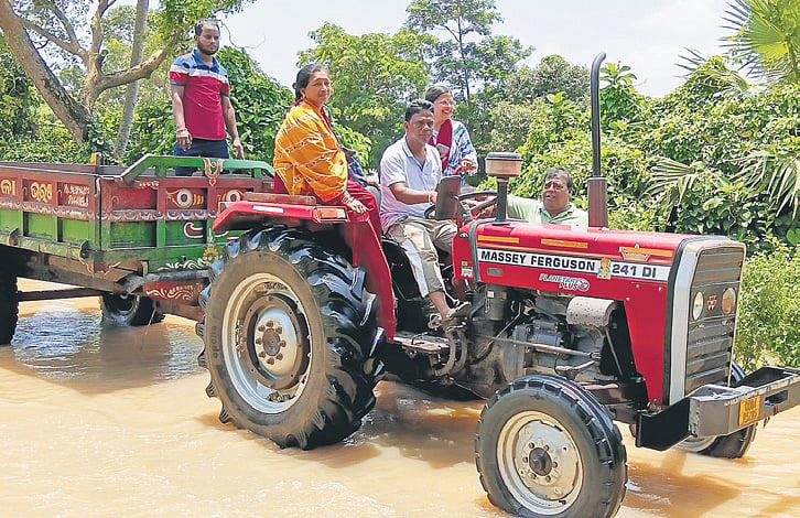 In Odisha highway submereged under water, tractor is only mode of transport