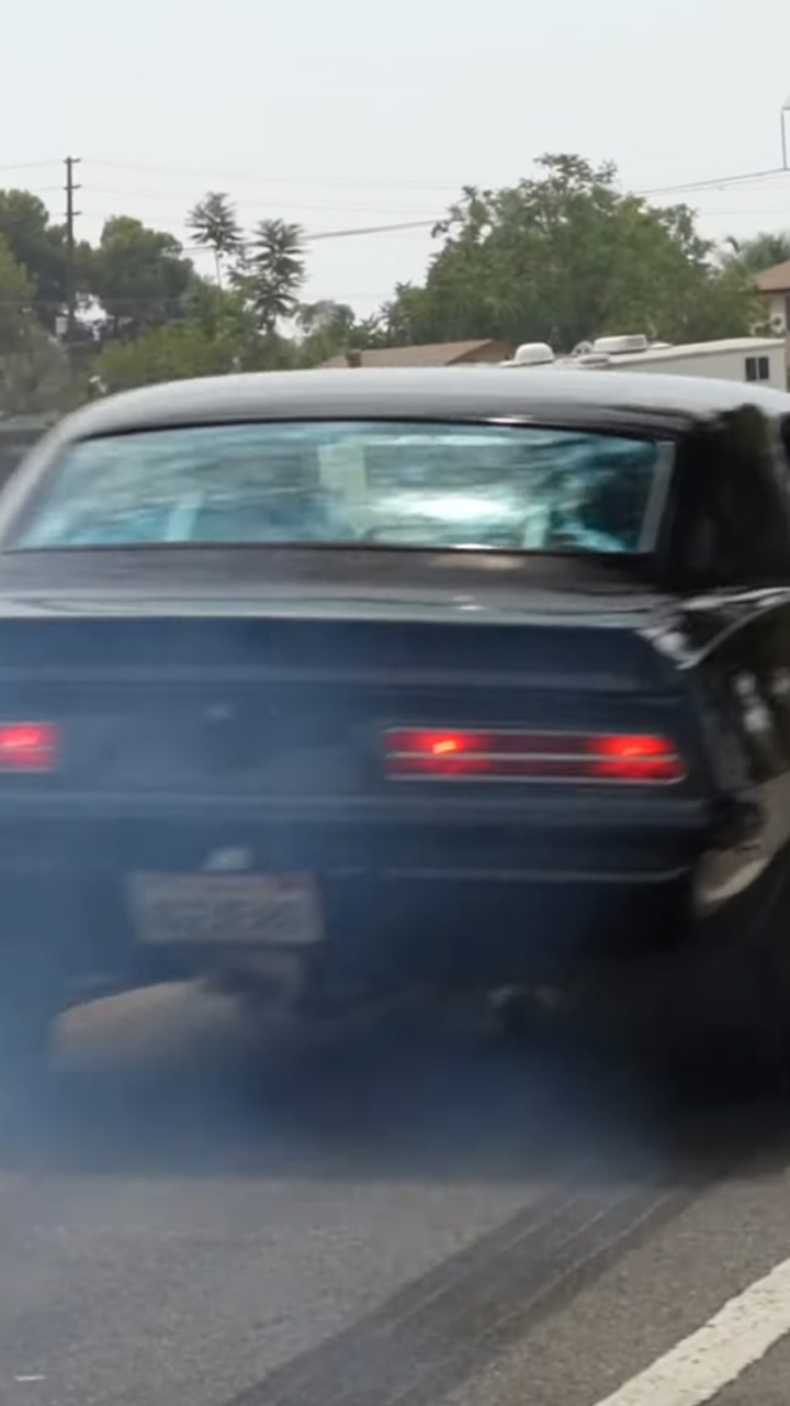 Classic Chevrolet Camaro leaves dark tire marks