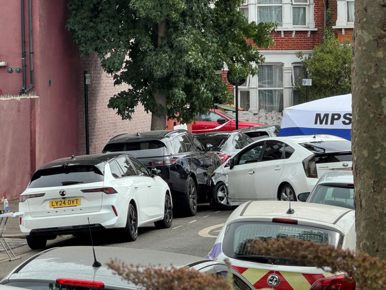 The scene on St Bartholomew's Road, Newham, east London, where Masum Miah was found inside a vehicle with gunshot wounds (PA)
