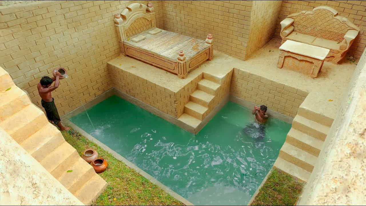 Builder creates an underground mud resort with a living room and pool