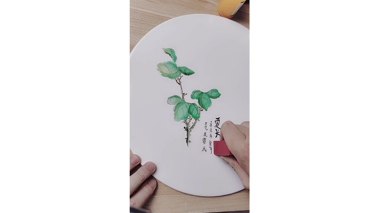 Drawing fresh green leaves with ink creating elegant botanical illustration