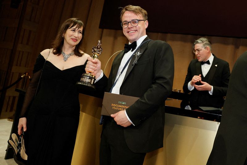 FILE PHOTO: Pavel Talankin, winner of the Oscar for Best Documentary Feature Film for "Mr. Nobody Against Putin", poses at the Governors Ball following the Oscars show at the 98th Academy Awards in Hollywood, Los Angeles, California, U.S., March 15, 2026. REUTERS/Carlos Barria/File Photo