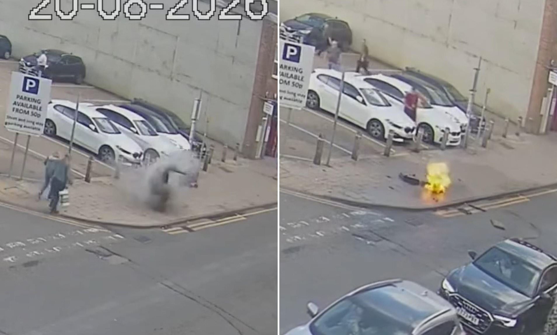 Moment pavement explodes just feet from shoppers before flames start leaping from hole