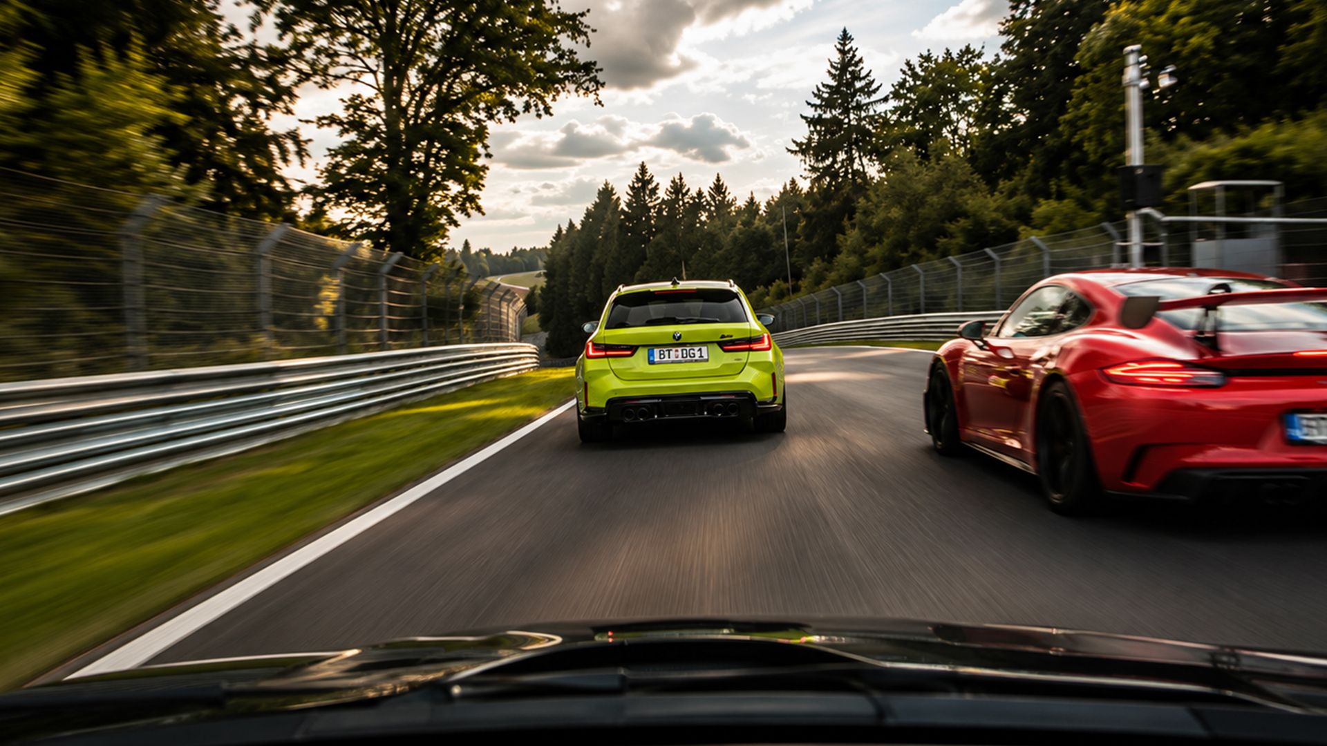 The driver takes aim at a BMW M3 Touring and Porsche 911