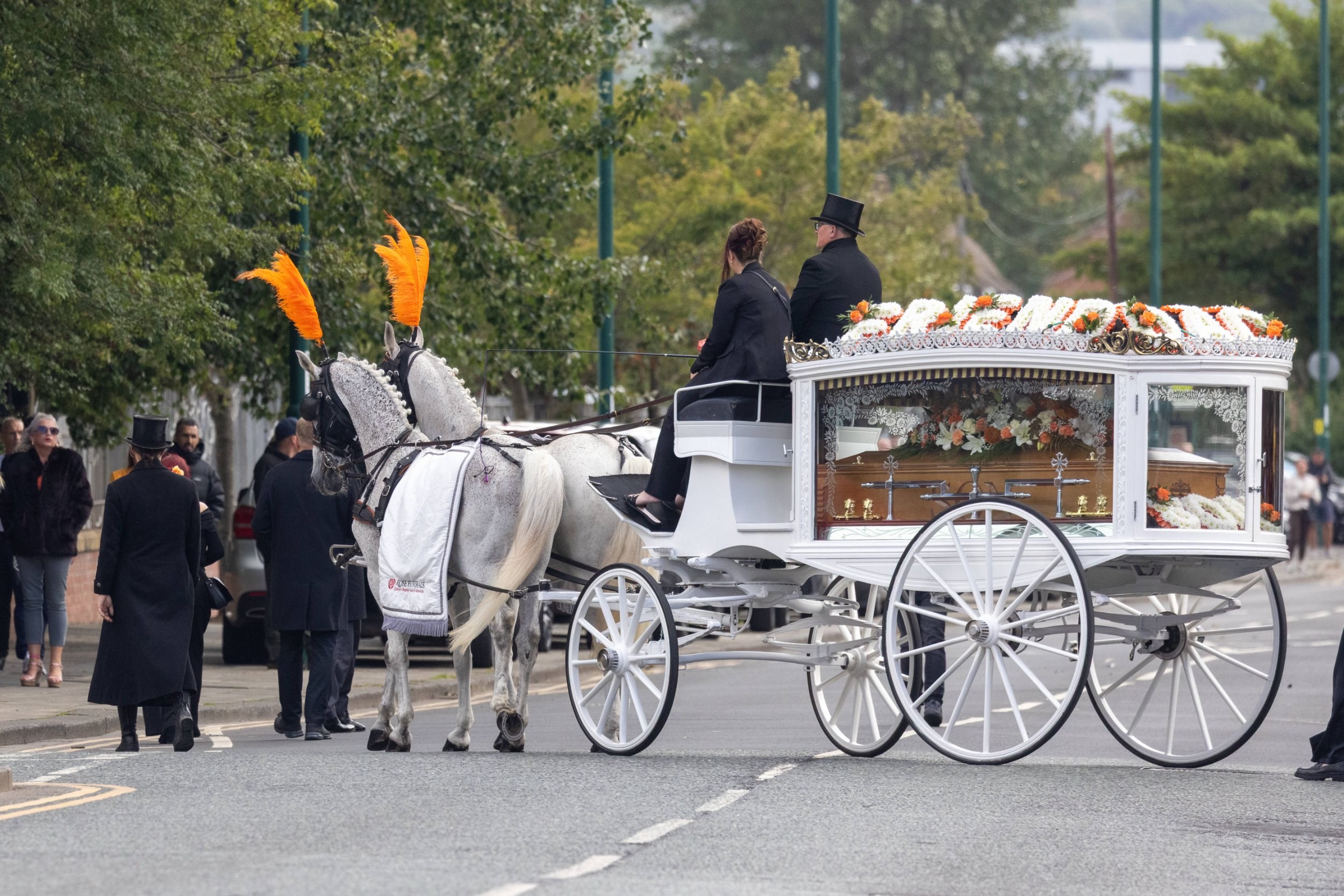 Procession led by horses and Lamborghini as hundreds gather for first ...
