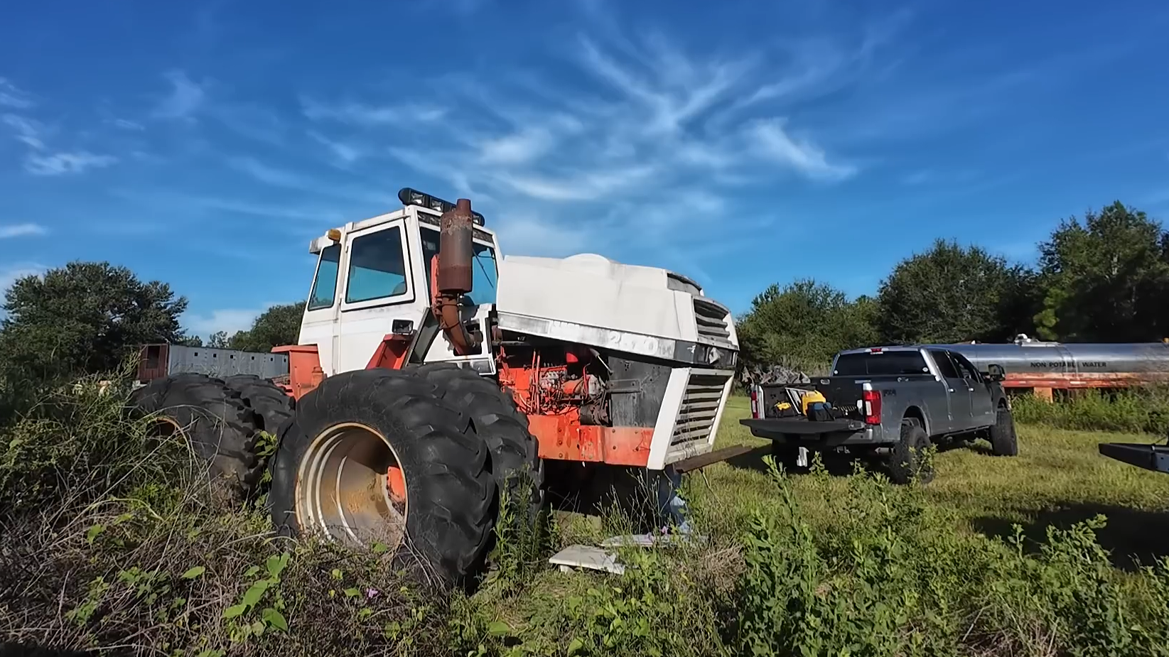 A huge Case tractor was abandoned in a field
