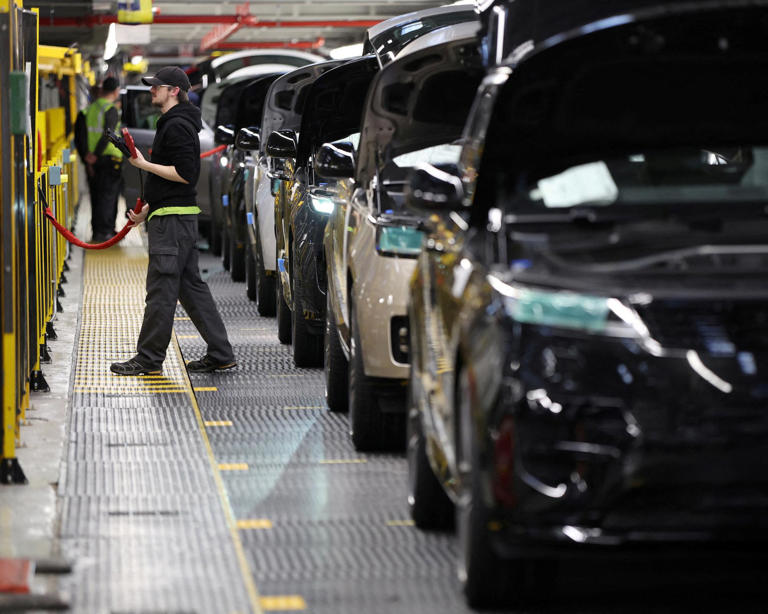 A technician works on the production line at Jaguar Land Rover’s factory in Solihull. Photograph: Phil Noble/Reuters