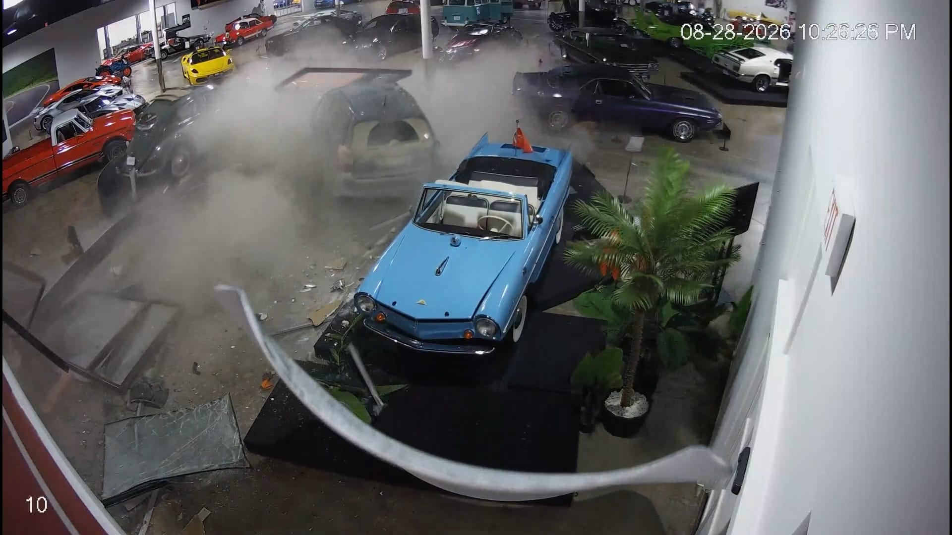 Car crashes into car collection building